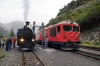 DFB 2-6-0RT #1 stands at Gletsch with 131 1015 Realp - Oberwald with MGB HGm4/4 #61, on hire to DFB, stands alongside with the stock for 241 1315 Gletsch - Oberwald