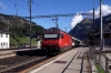 SBB 460049 runs through Kandersteg while BLS Re425 162 waits with a car train for Goppenstein