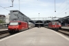 SBB Re460 460095 waits at Luzern with IR2340 1310 Luzern - Zurich Airport while Re 4/4 II (Re420) 11127 departs with IR2174 0945 Locarno - Basel (which was worked in by 11212)