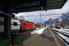SBB Re460 460028 departs Landquart with IC570 1009 Chur - Zurich HB, DB 185131 stands spare