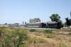 DK89 waits in the blistering sunshine to cross another train at Sidi S'mail with 14 1150 Ghardimaou - Tunis
