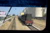 Through the cab window of DP151, working 14 1150 Ghardimaou - Tunis, DI70 hammers away from Manouba with a westbound freight