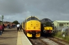 37674 brings up the rear of the 0835 Northallerton West - Redmire at Leeming Bar, 47715 leads the train; 37057 stands in the loop