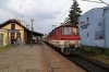 ZSSK 240005 runs through Zvolen Mesto with an empty stock towards Zvolen OS